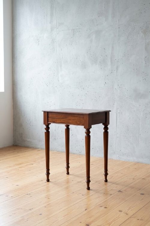 A narrow antique mahogany console table featuring turned legs and a polished timber top against a plain white background. View XV