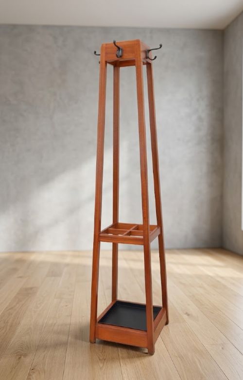 A tall tapered solid mahogany hall coat stand featuring top metal hooks, an umbrella divider section, and a dark metal drip tray base. View XV