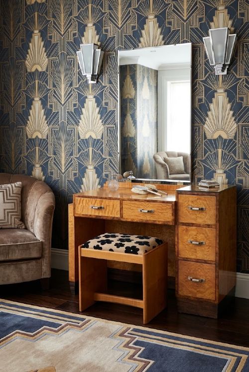 fig 3. An Art Deco asymmetrical dressing table crafted in burr maple veneer with an offset pedestal of drawers and a large frameless mirror.