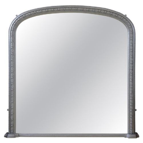 An arched antique French silver gilt overmantel mirror featuring a moulded frame with subtle beaded detailing and rounded upper corners. View II