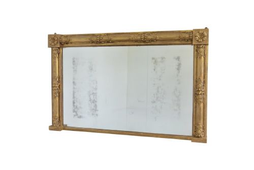 fig 1. A large 19th-century rectangular giltwood overmantel mirror featuring carved corner rosettes and floral mouldings.