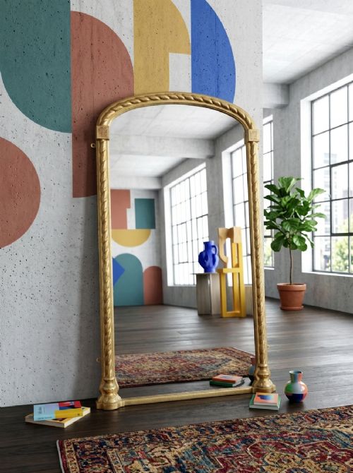 A tall arched gilded pier mirror featuring rope-twist carving, square corner block details, and reflective glass with light foxing. View XIV