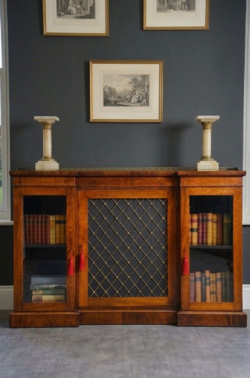 A pair of low Victorian cream onyx columns featuring ornate brass ormolu capitals and square tiered bases. View XV