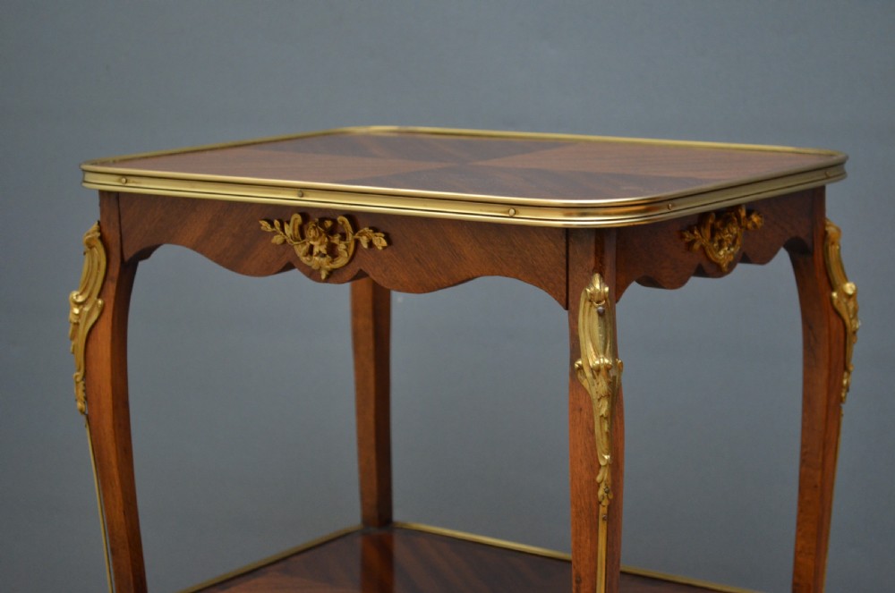 A rectangular two-tier wooden side table featuring inlaid veneers, curved cabriole legs, and ornate brass mounts. View III