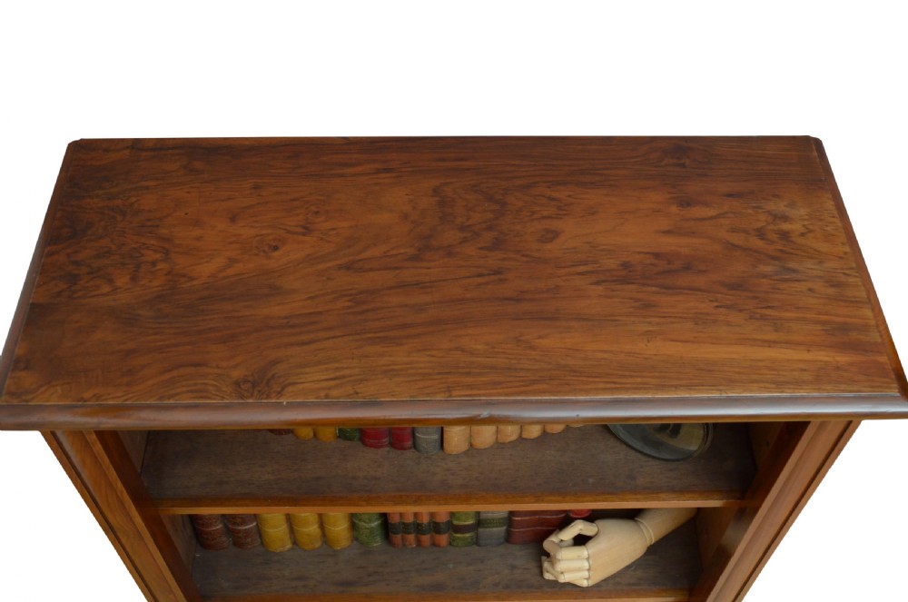 A low Victorian open bookcase crafted from walnut wood with three horizontal shelves. View V
