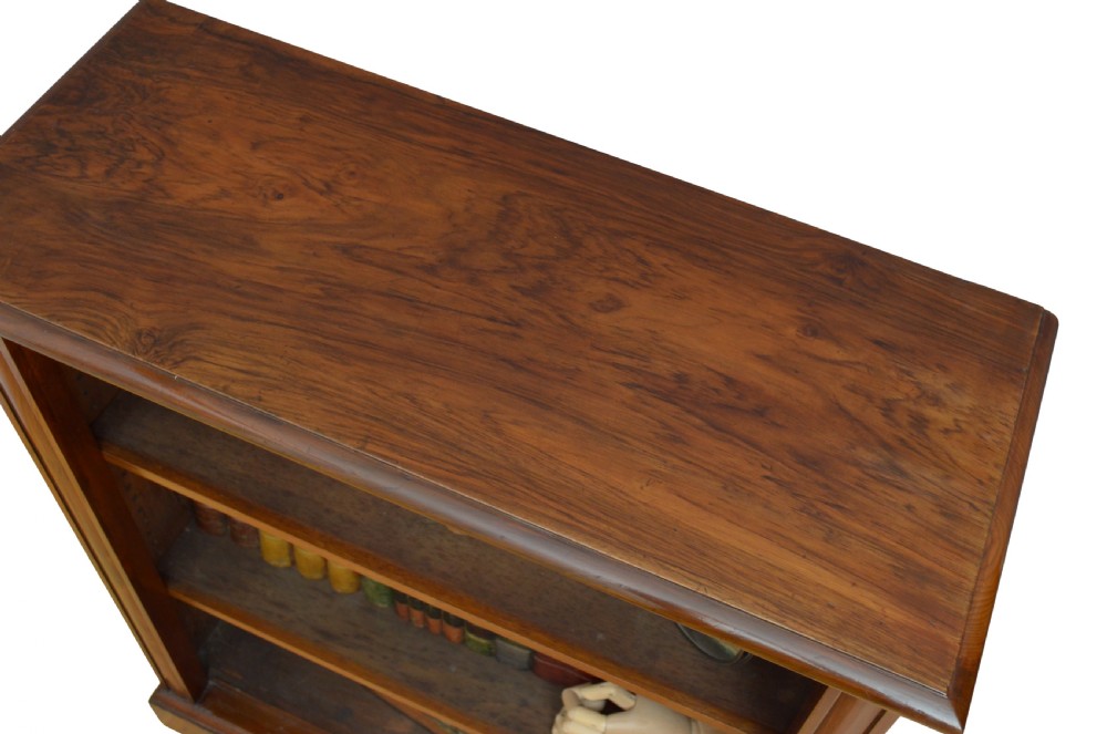 A low Victorian open bookcase crafted from walnut wood with three horizontal shelves. View VI