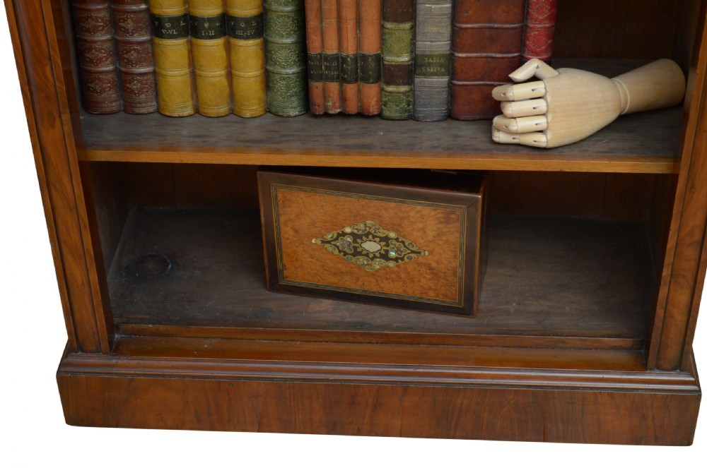 A low Victorian open bookcase crafted from walnut wood with three horizontal shelves. View XII