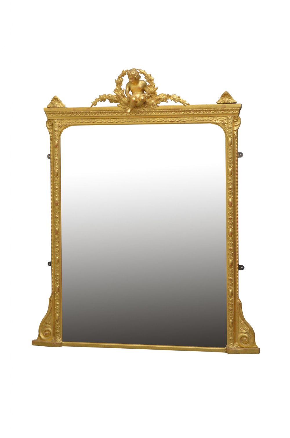 An ornate antique giltwood mantel mirror featuring a carved cherub crest and classical detailing.