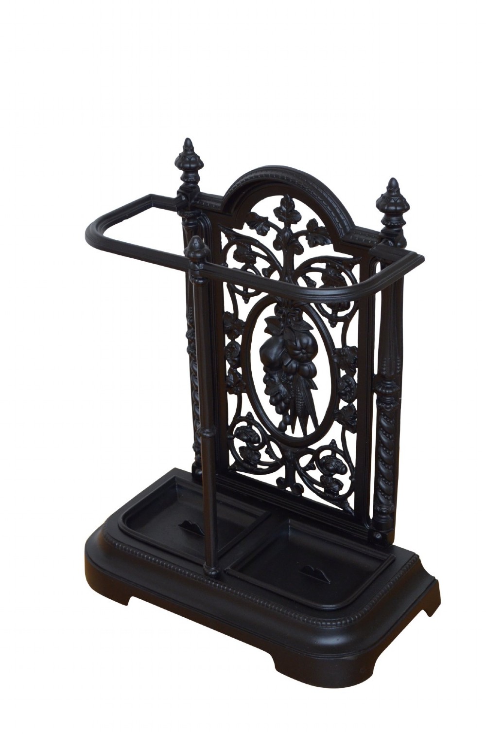 A Victorian black cast iron umbrella stand featuring an ornate foliage backplate, top railing, finials, and a removable drip tray base. View II