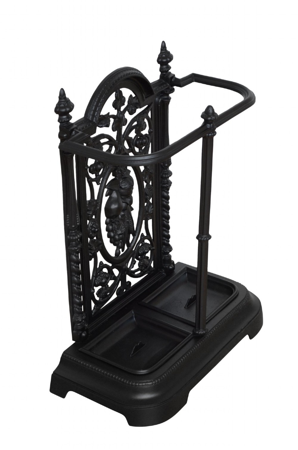A Victorian black cast iron umbrella stand featuring an ornate foliage backplate, top railing, finials, and a removable drip tray base.