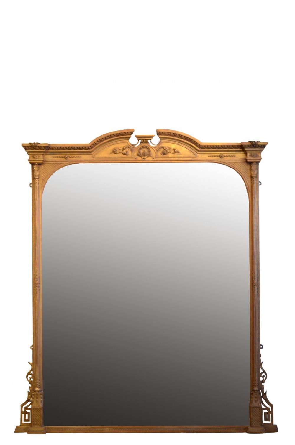 A large rectangular giltwood overmantel mirror featuring an arched top frame, carved cresting, side pilasters, and a gold finish.