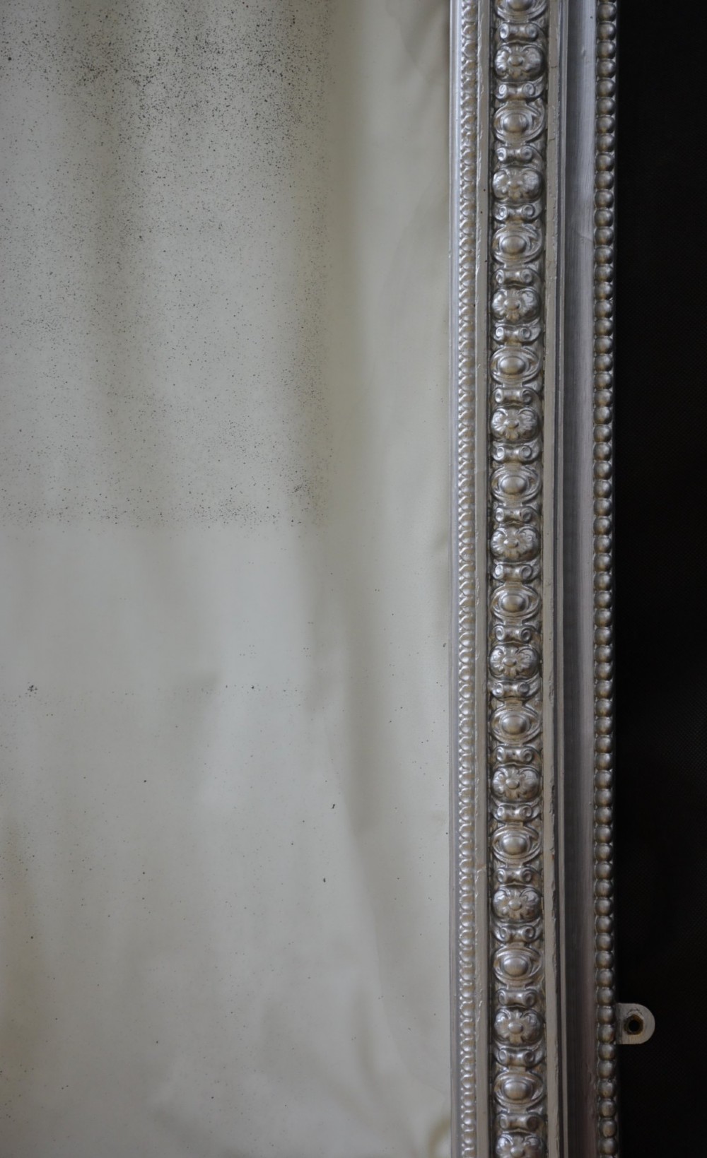 An arched Victorian silver-gilded overmantel mirror featuring beaded edge moulding along the frame. View VI