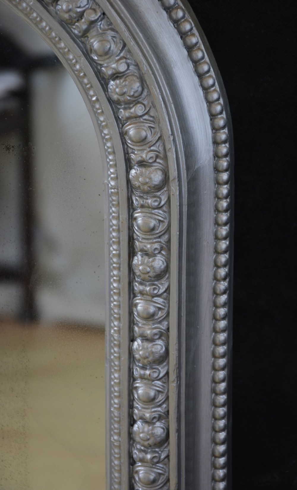 An arched Victorian silver-gilded overmantel mirror featuring beaded edge moulding along the frame. View VIII