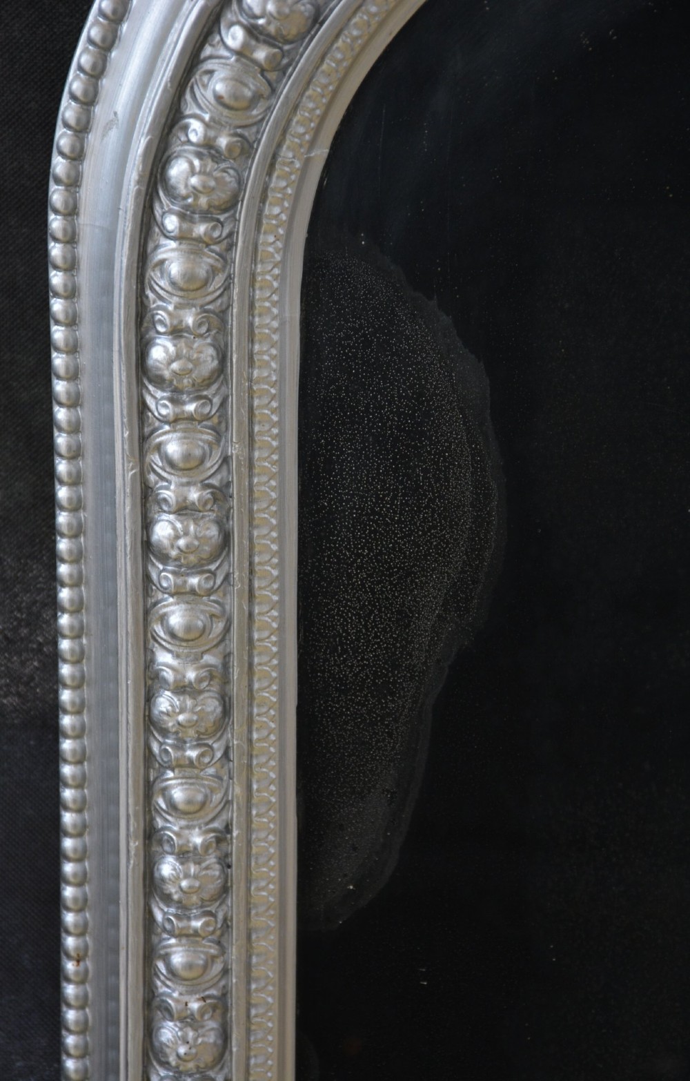 An arched Victorian silver-gilded overmantel mirror featuring beaded edge moulding along the frame. View XII