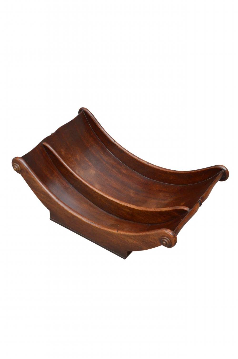 A Georgian mahogany cheese coaster displaying a crescent-shaped wooden body with carved scroll terminals and a central dividing partition. View II