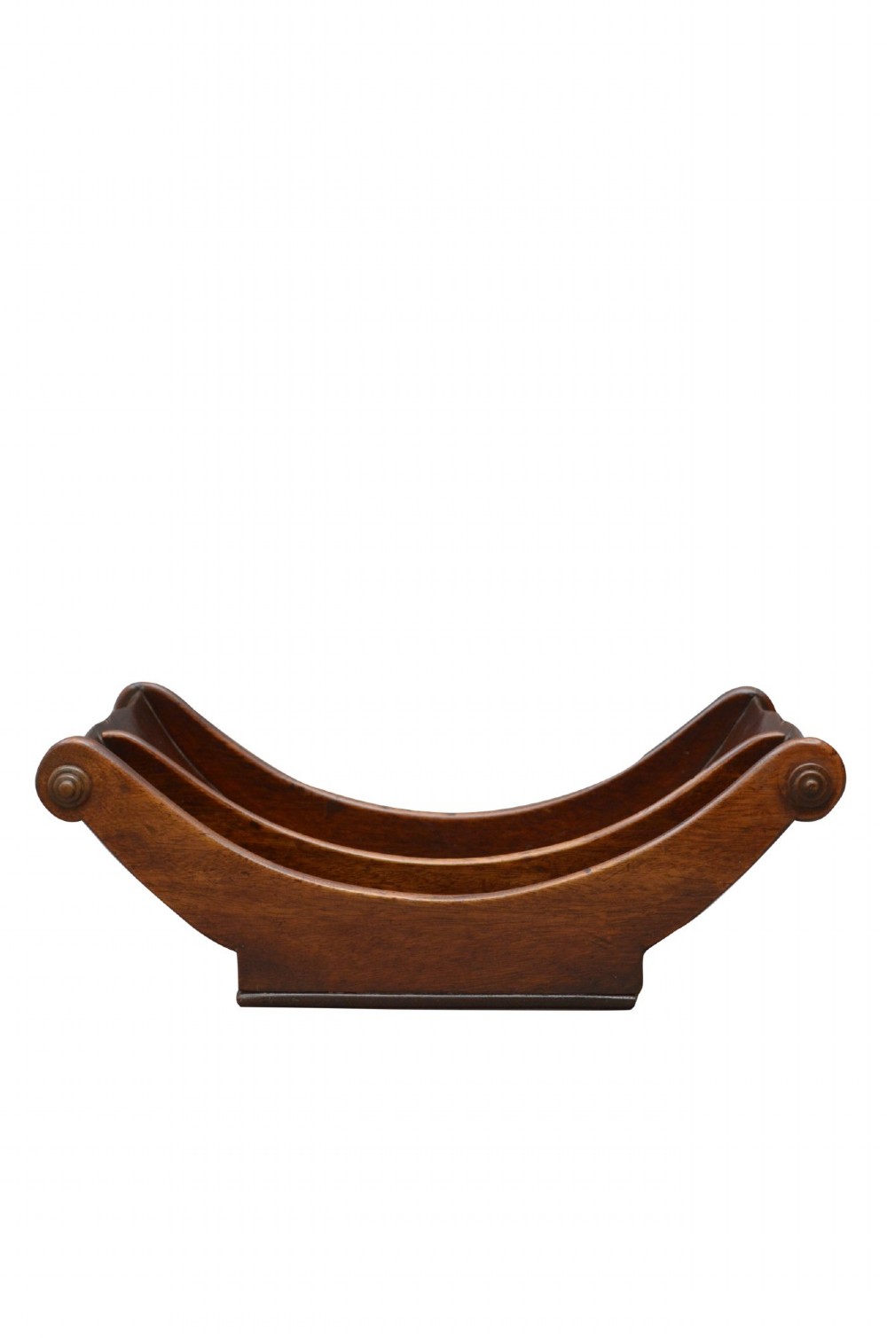 A Georgian mahogany cheese coaster displaying a crescent-shaped wooden body with carved scroll terminals and a central dividing partition. View V