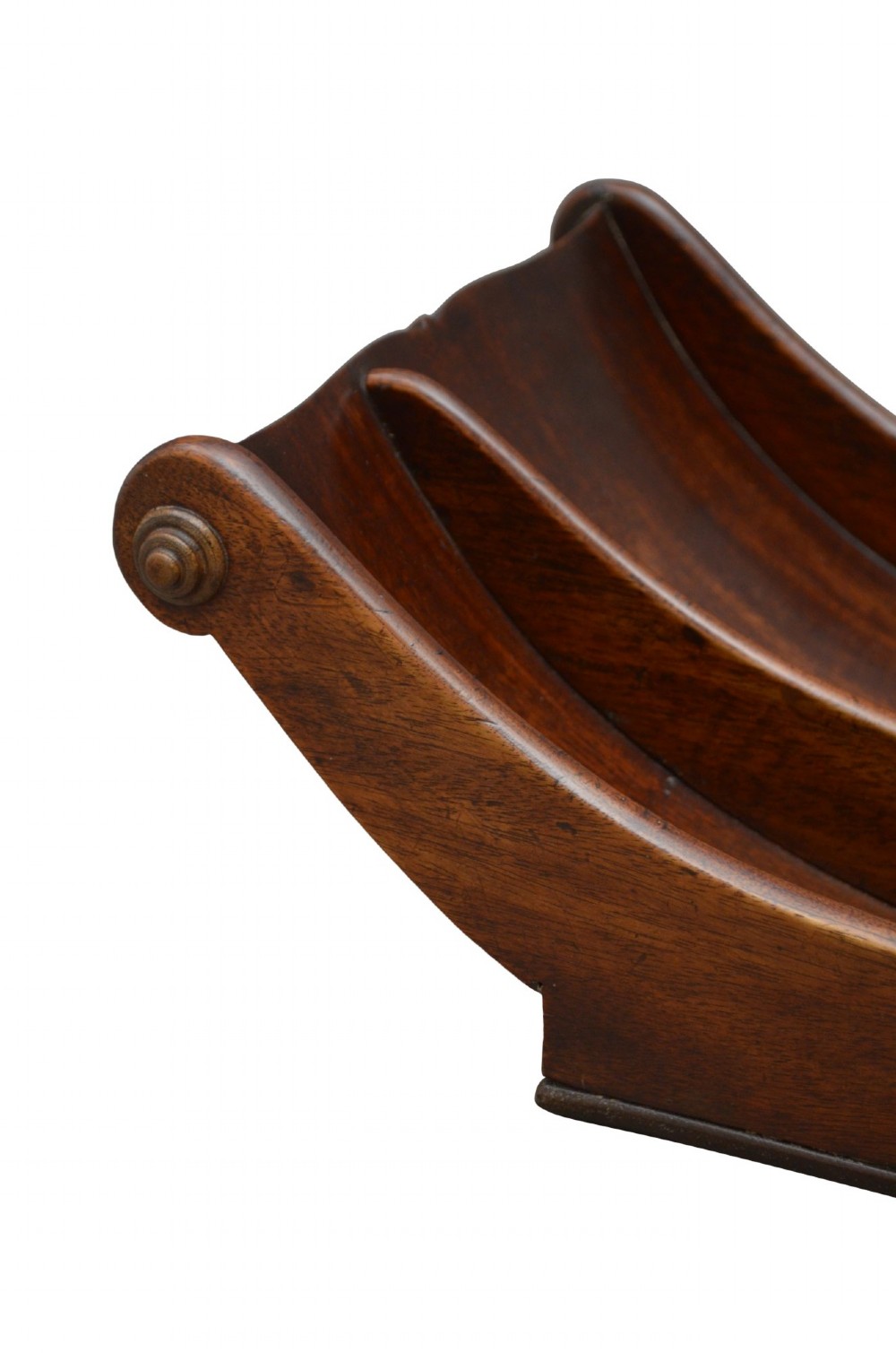 A Georgian mahogany cheese coaster displaying a crescent-shaped wooden body with carved scroll terminals and a central dividing partition. View VI