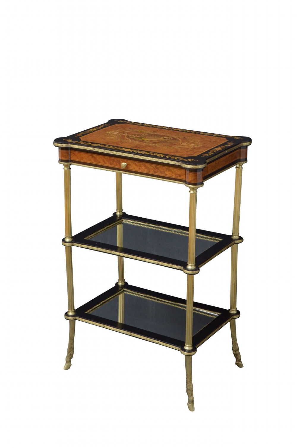 A French Louis XVI style three-tier occasional table featuring an inlaid marquetry top with a drawer, polished brass column supports, and glass lower shelves.