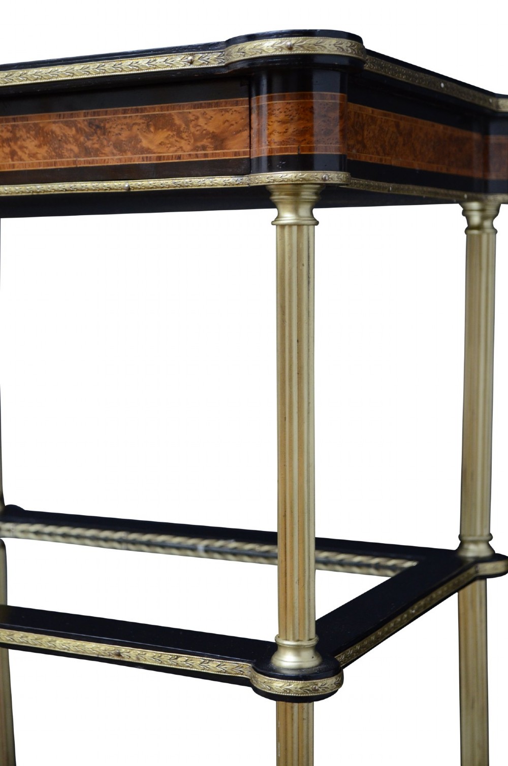 A French Louis XVI style three-tier occasional table featuring an inlaid marquetry top with a drawer, polished brass column supports, and glass lower shelves. View VI