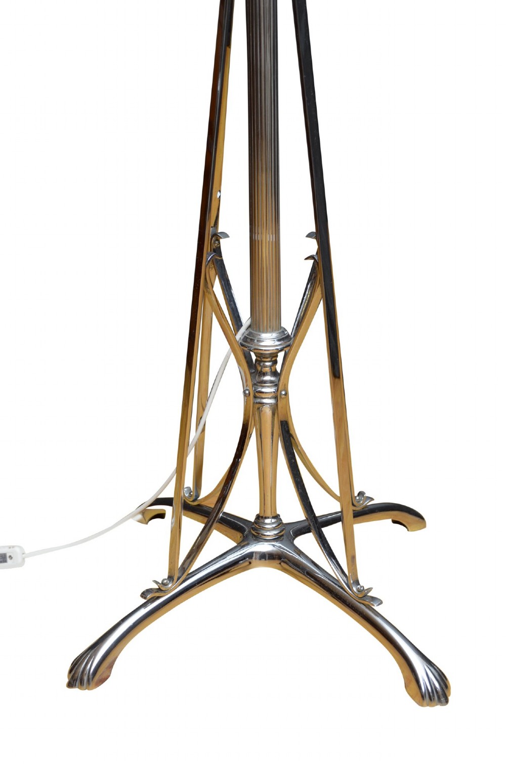 An Art Deco metal standard lamp featuring a fluted central stem, tripod sweeping base supports, and a scalloped white fabric shade. View VI