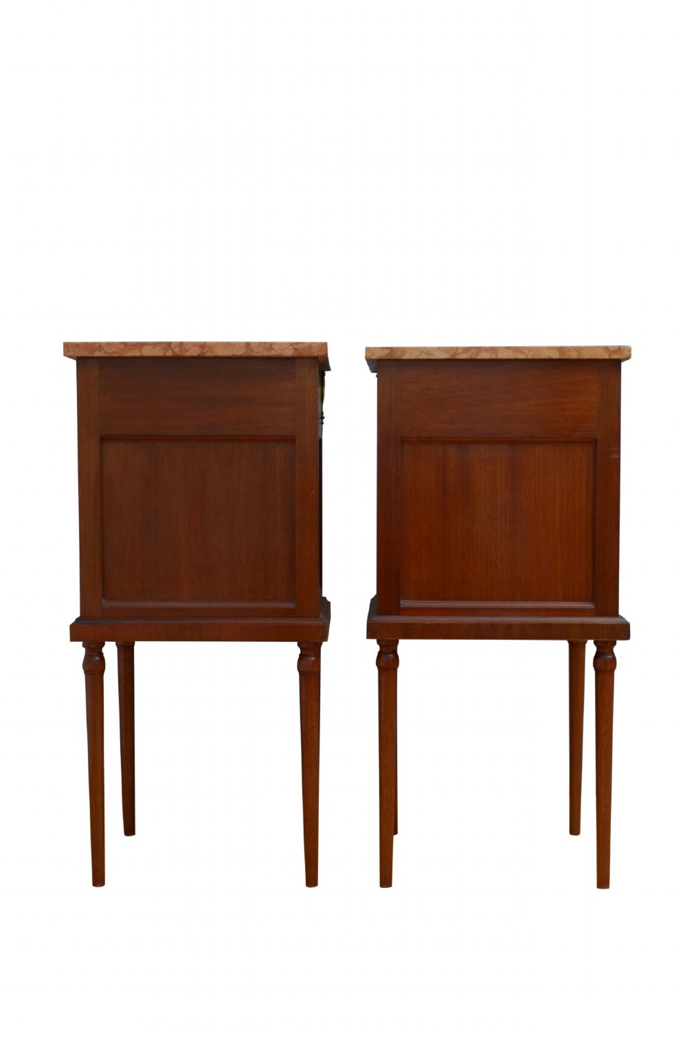 A pair of tall French Louis XVI style wooden bedside cabinets featuring pink marble tops, single drawers, cupboard doors with sunburst parquetry motifs, and slender turned legs. View VI