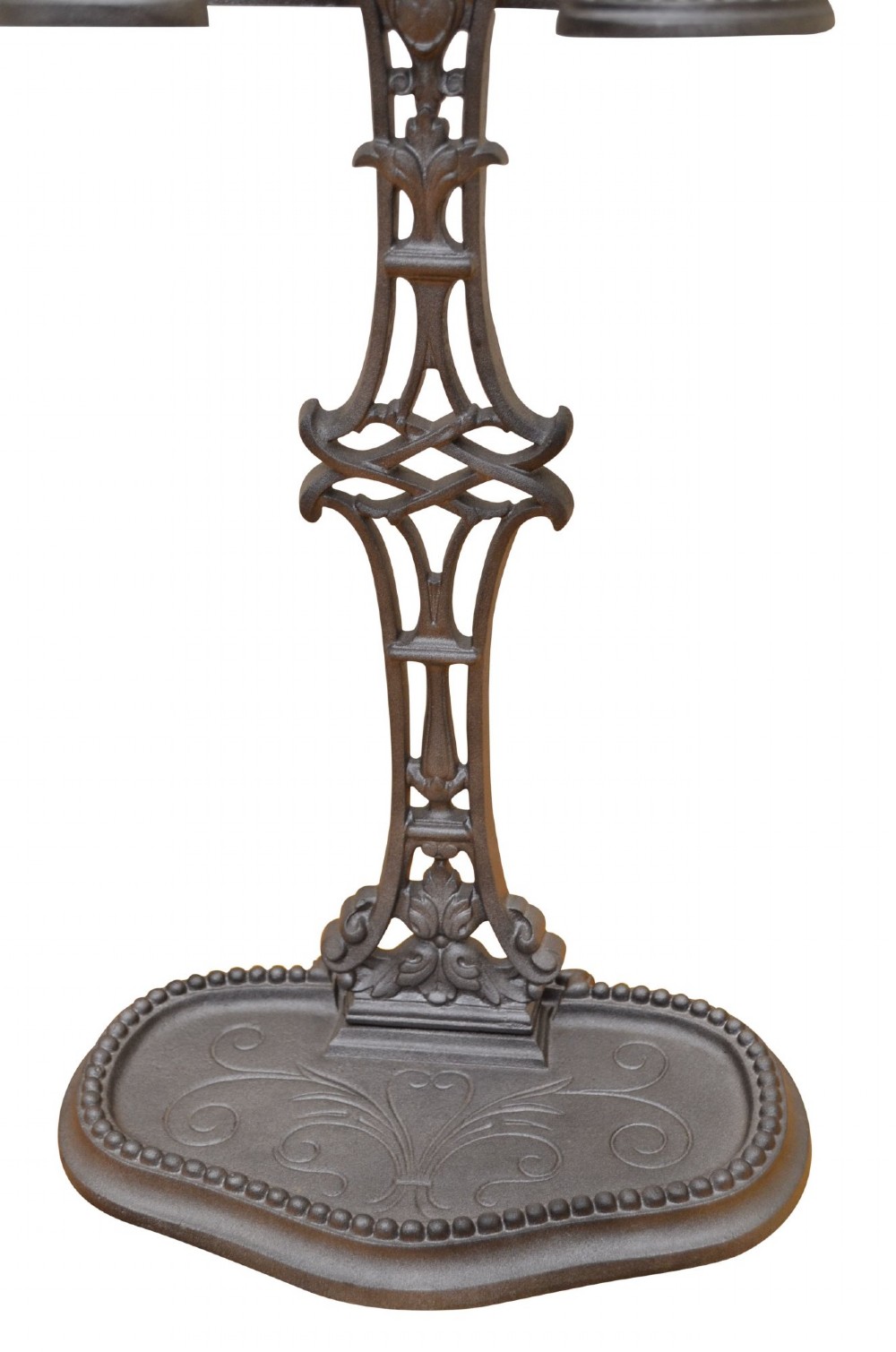 A cast iron umbrella stand featuring a central decorative stem, two curved upper retaining arms, a top loop handle, and an oval drip tray base. View VIII