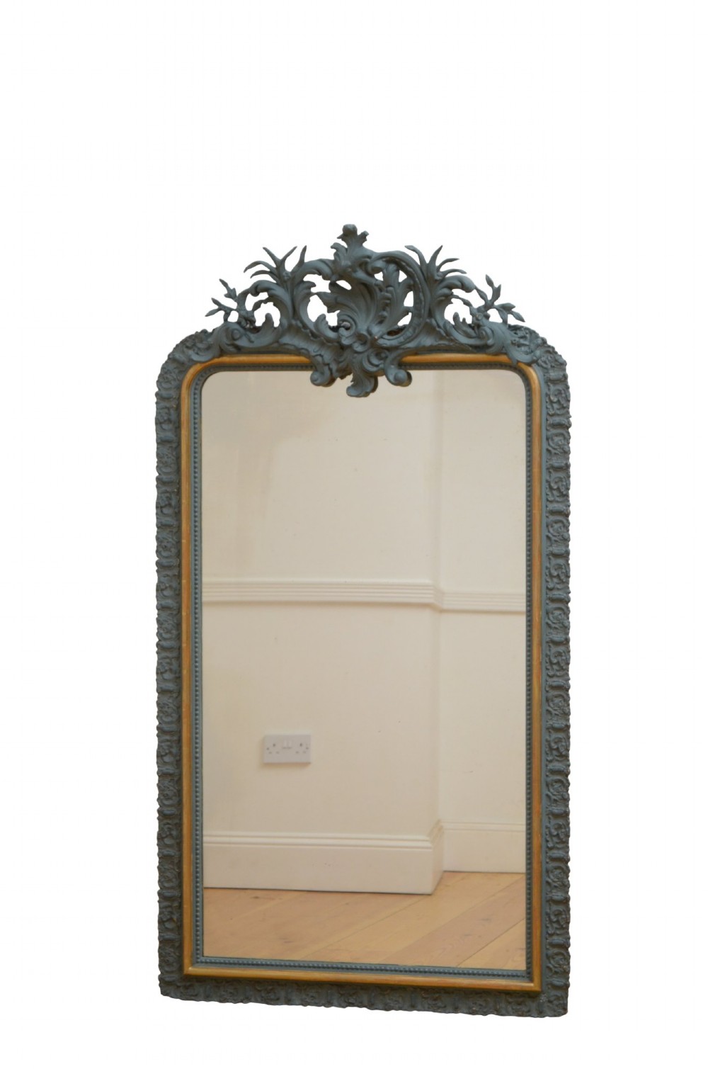 A tall rectangular wall mirror featuring a dark grey carved frame with a golden inner bead and an intricate foliage crest at the top. View IV