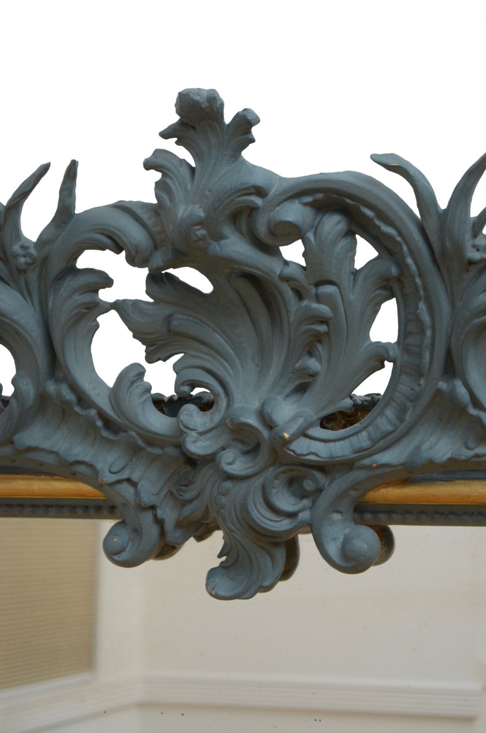 A tall rectangular wall mirror featuring a dark grey carved frame with a golden inner bead and an intricate foliage crest at the top. View XI