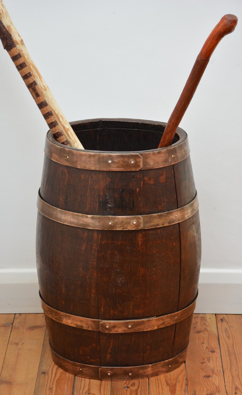 A Victorian dark oak coopered barrel umbrella stand with polished metal binding hoops. View VIII