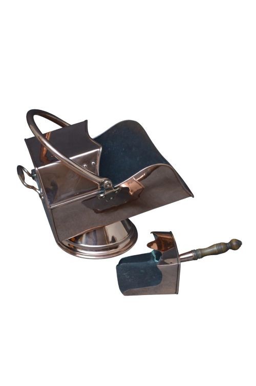 A copper coal helmet scuttle with a fixed overhead swing handle, riveted construction, and an integrated shovel with a turned wooden handle. View VIII