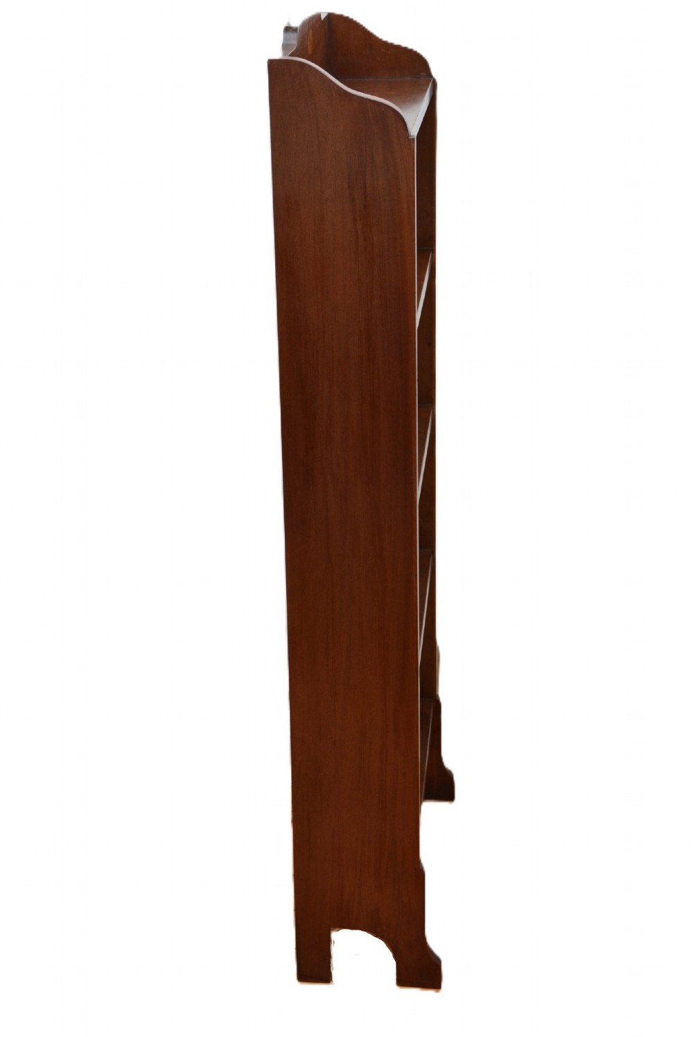 A slim Edwardian mahogany open bookcase featuring four shelves, an inlaid oval motif on the shaped gallery top, and bracket feet. View IX