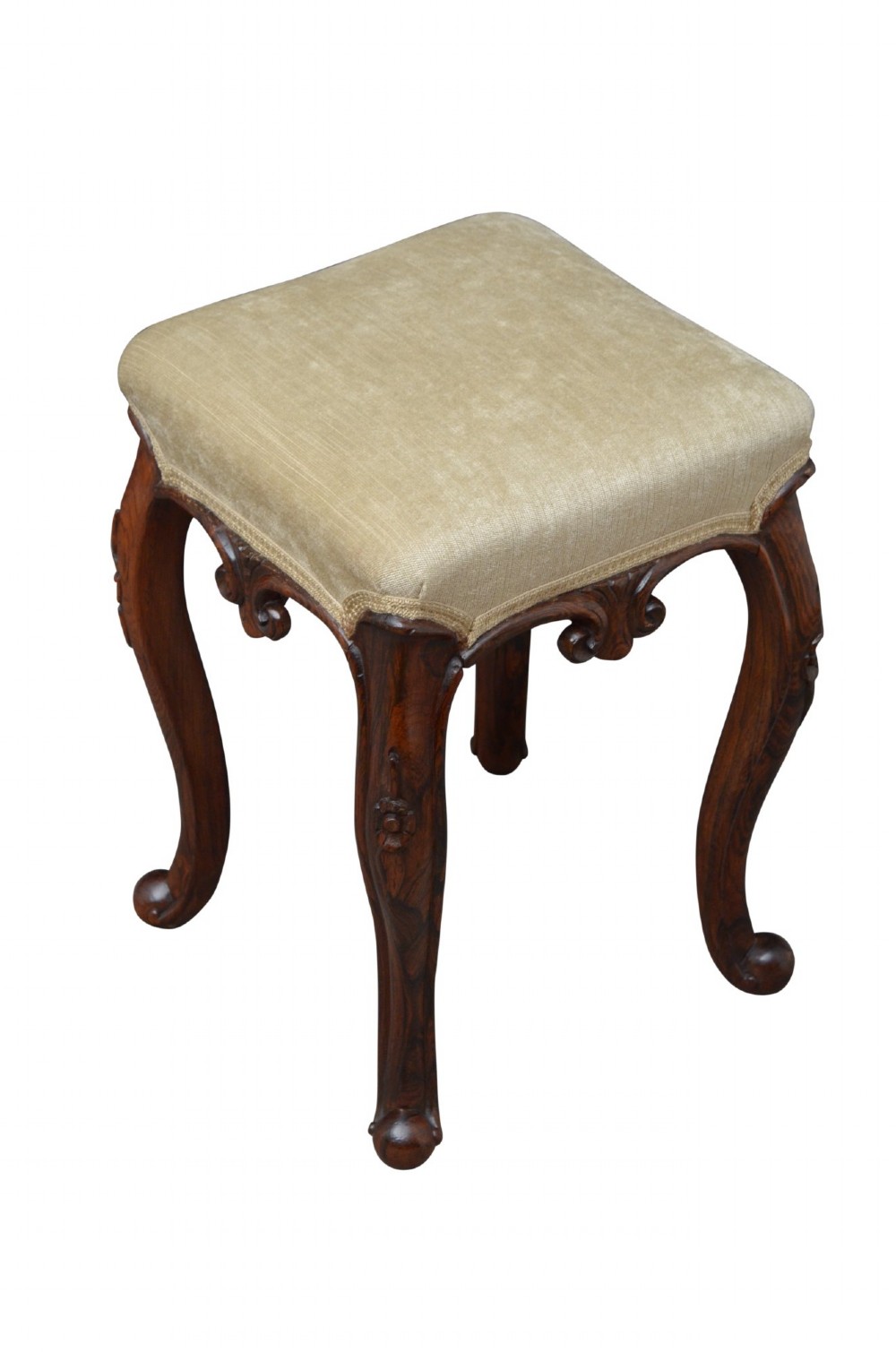 An antique carved dark rosewood stool featuring cabriole legs and a neutral upholstered padded seat. View II