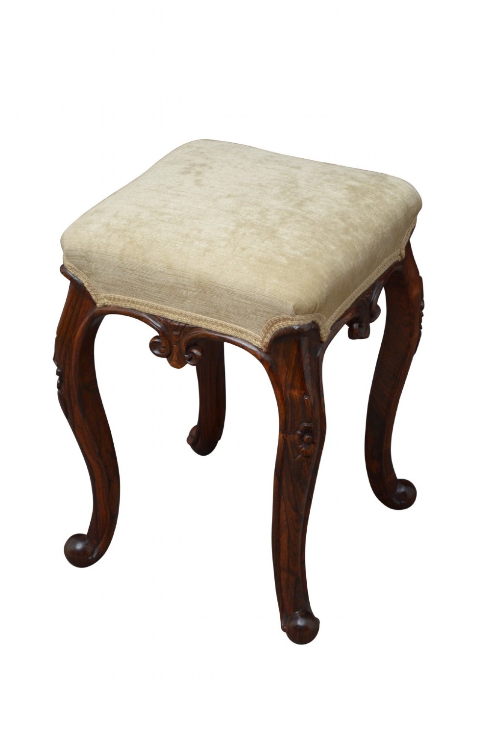 An antique carved dark rosewood stool featuring cabriole legs and a neutral upholstered padded seat. View III