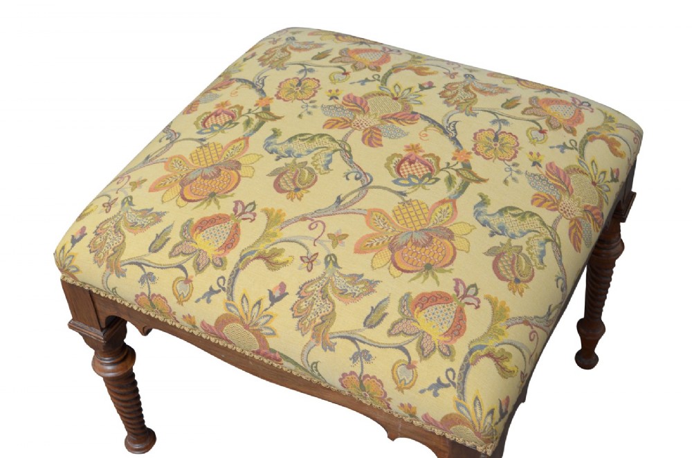 A walnut dressing table stool with turned barley twist legs and a padded seat upholstered in yellow floral patterned fabric. View II