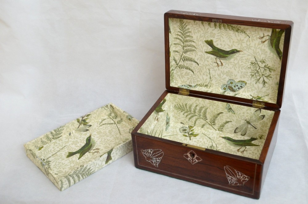 A rectangular dark rosewood jewellery box featuring brass foliate inlays and a central brass keyhole escutcheon. View IX