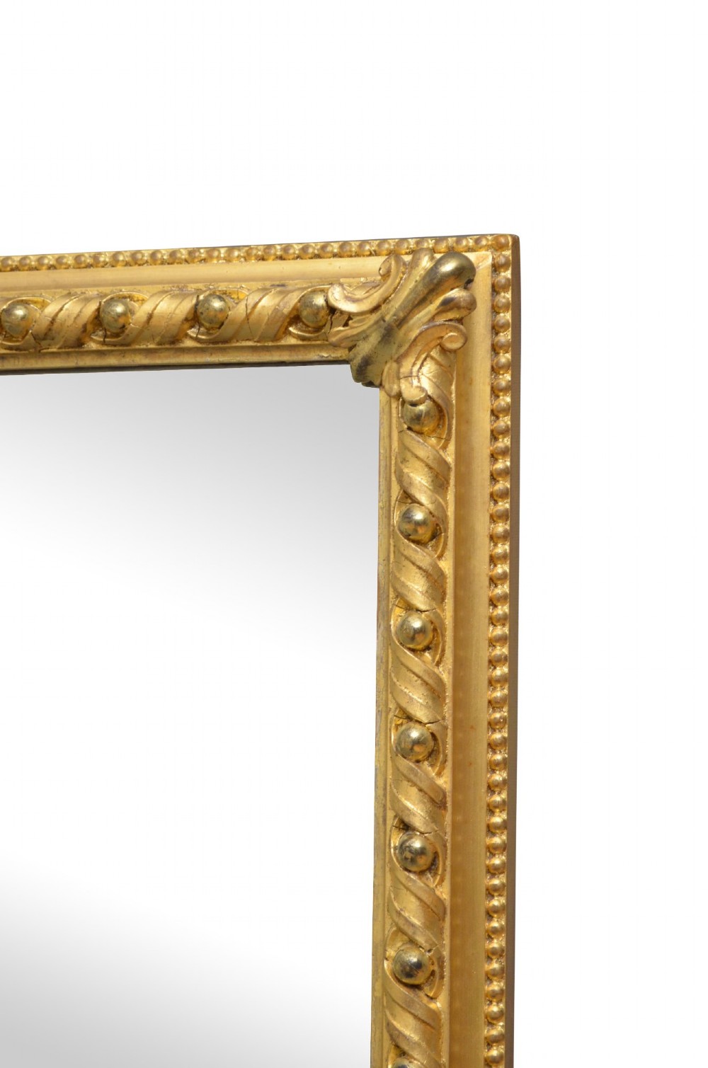 A rectangular antique overmantel mirror with a carved giltwood frame featuring rope-twist moulding, beaded edging, and scroll side feet. View II