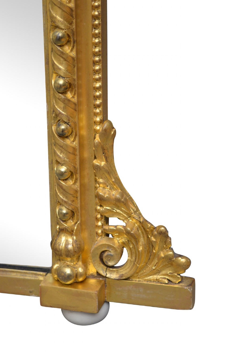 A rectangular antique overmantel mirror with a carved giltwood frame featuring rope-twist moulding, beaded edging, and scroll side feet. View III