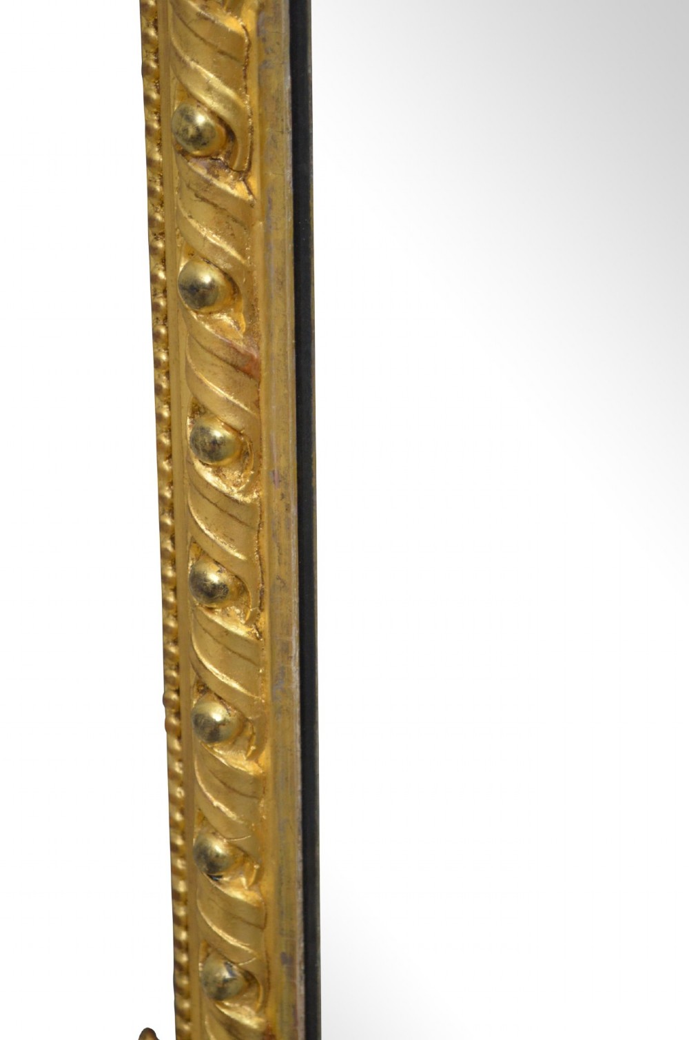 A rectangular antique overmantel mirror with a carved giltwood frame featuring rope-twist moulding, beaded edging, and scroll side feet. View VIII