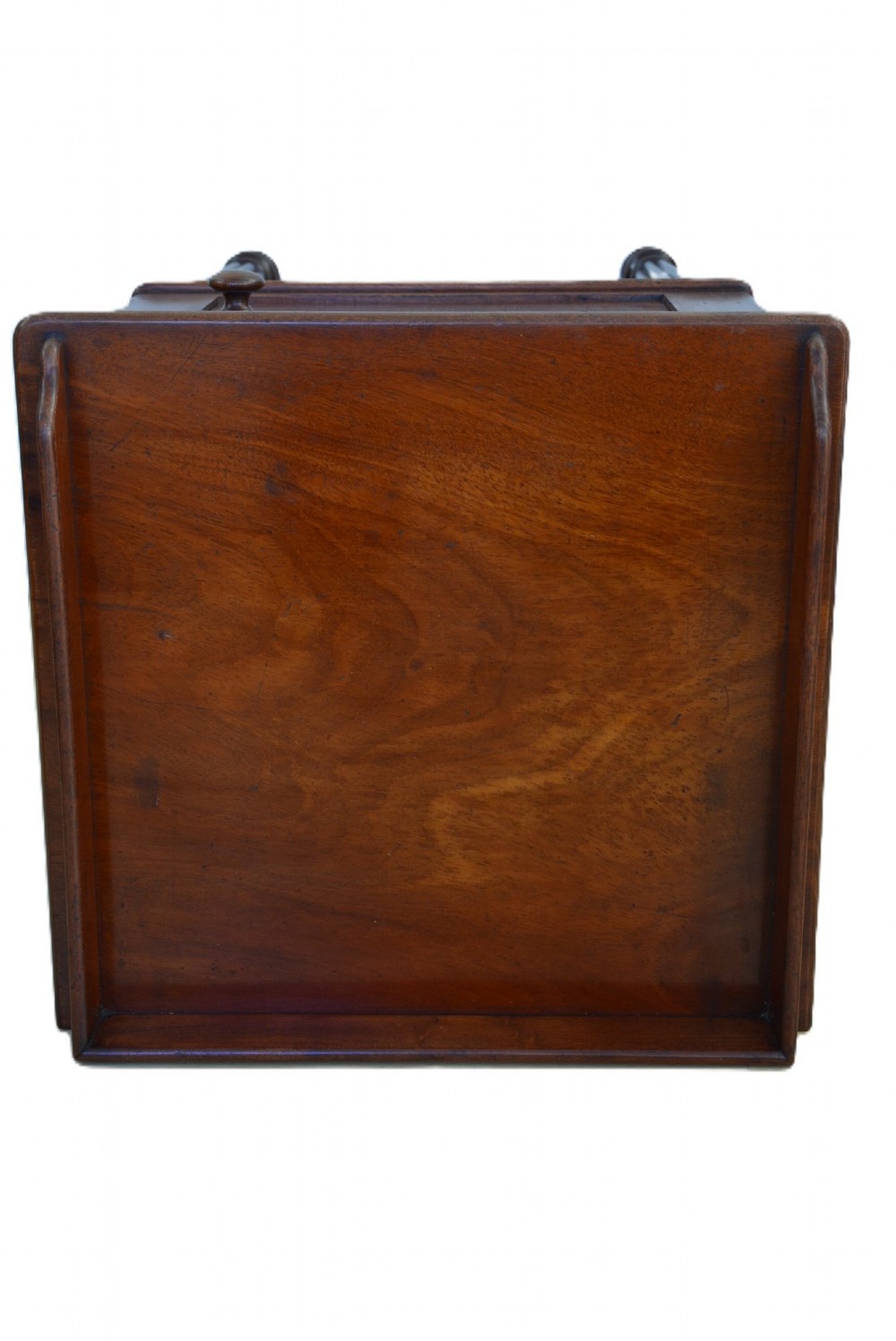 A dark mahogany bedside cabinet featuring a three-sided gallery top, a single door with a turned wooden knob, and four slender reeded legs. View VIII