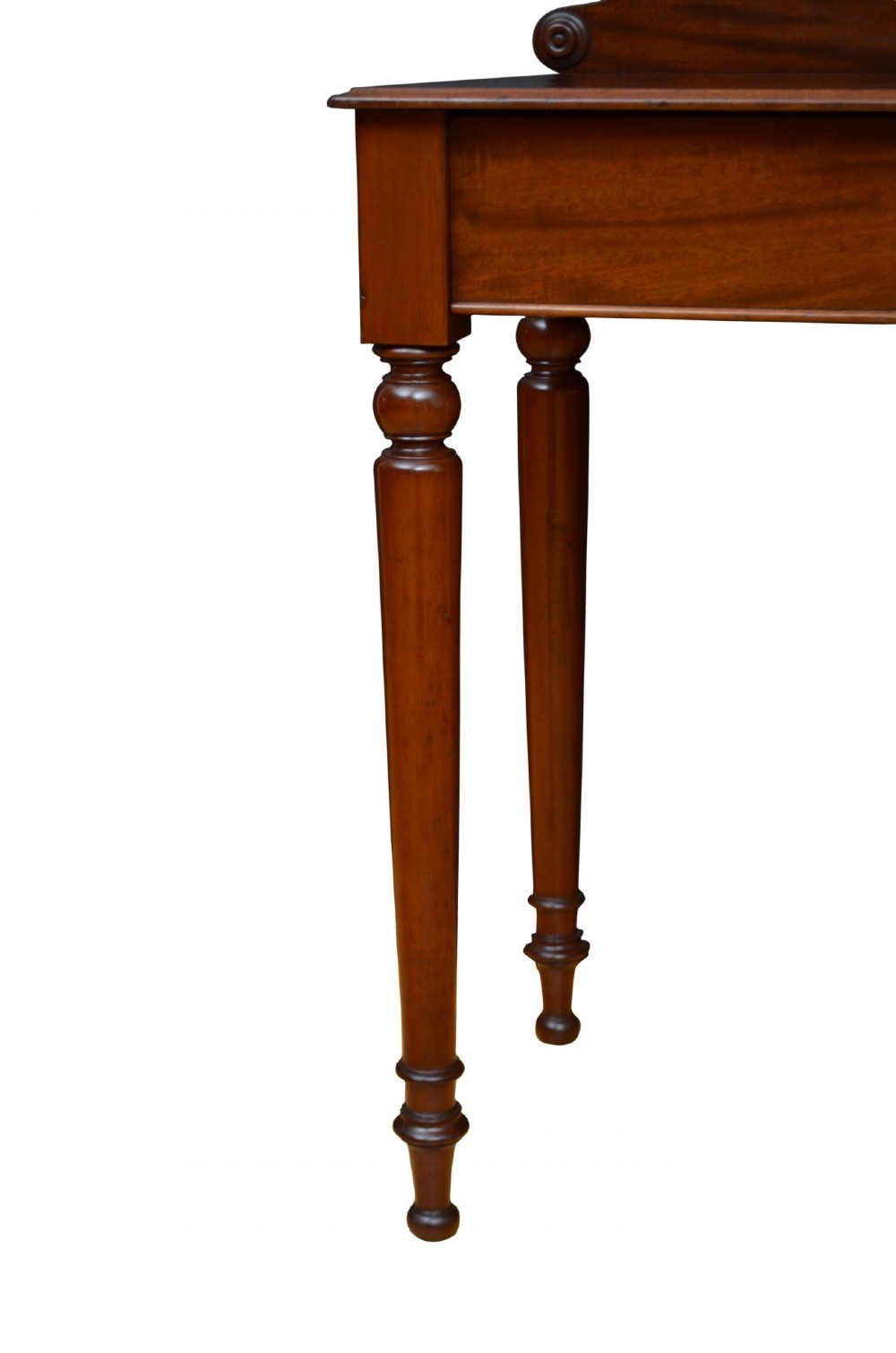 A Victorian mahogany hall table featuring a gallery back upstand, a single frieze drawer, and four turned legs. View VII