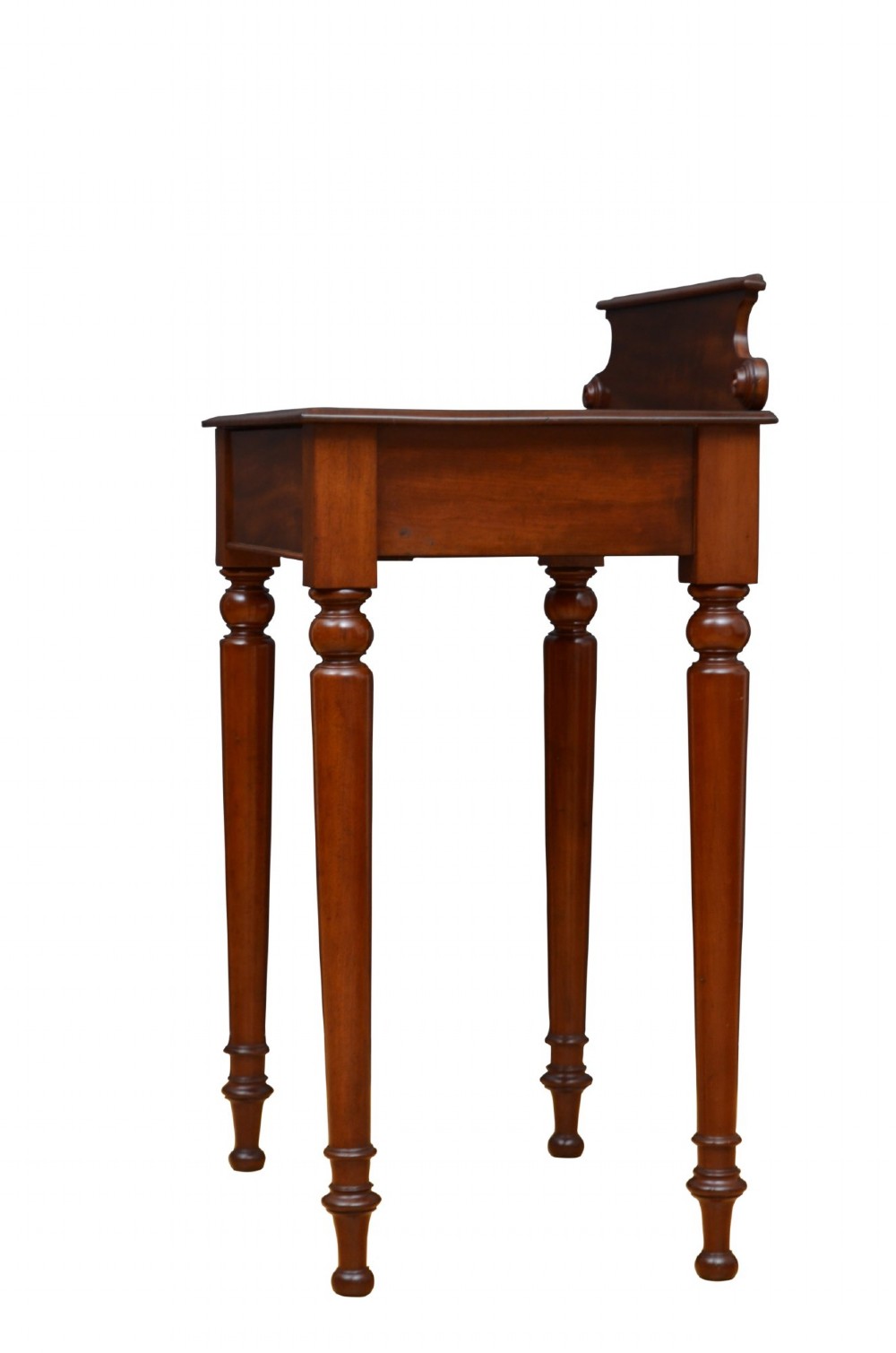 A Victorian mahogany hall table featuring a gallery back upstand, a single frieze drawer, and four turned legs. View XI
