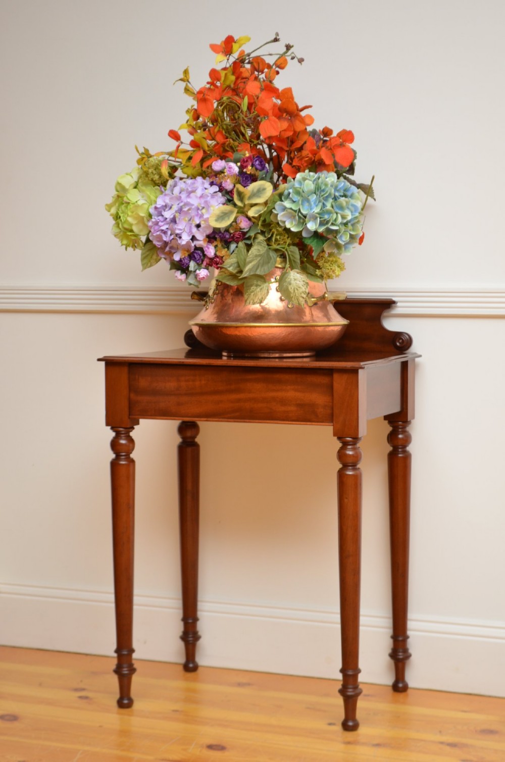 A Victorian mahogany hall table featuring a gallery back upstand, a single frieze drawer, and four turned legs. View XIII