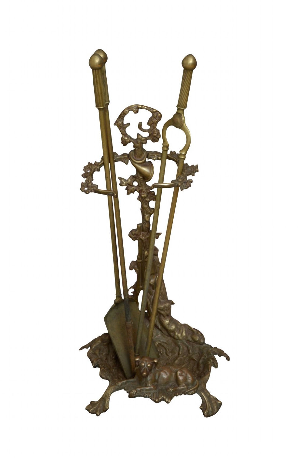 An antique cast brass stick stand featuring sporting motifs including a resting hound, rifle, game bag, and hunting horn. View III