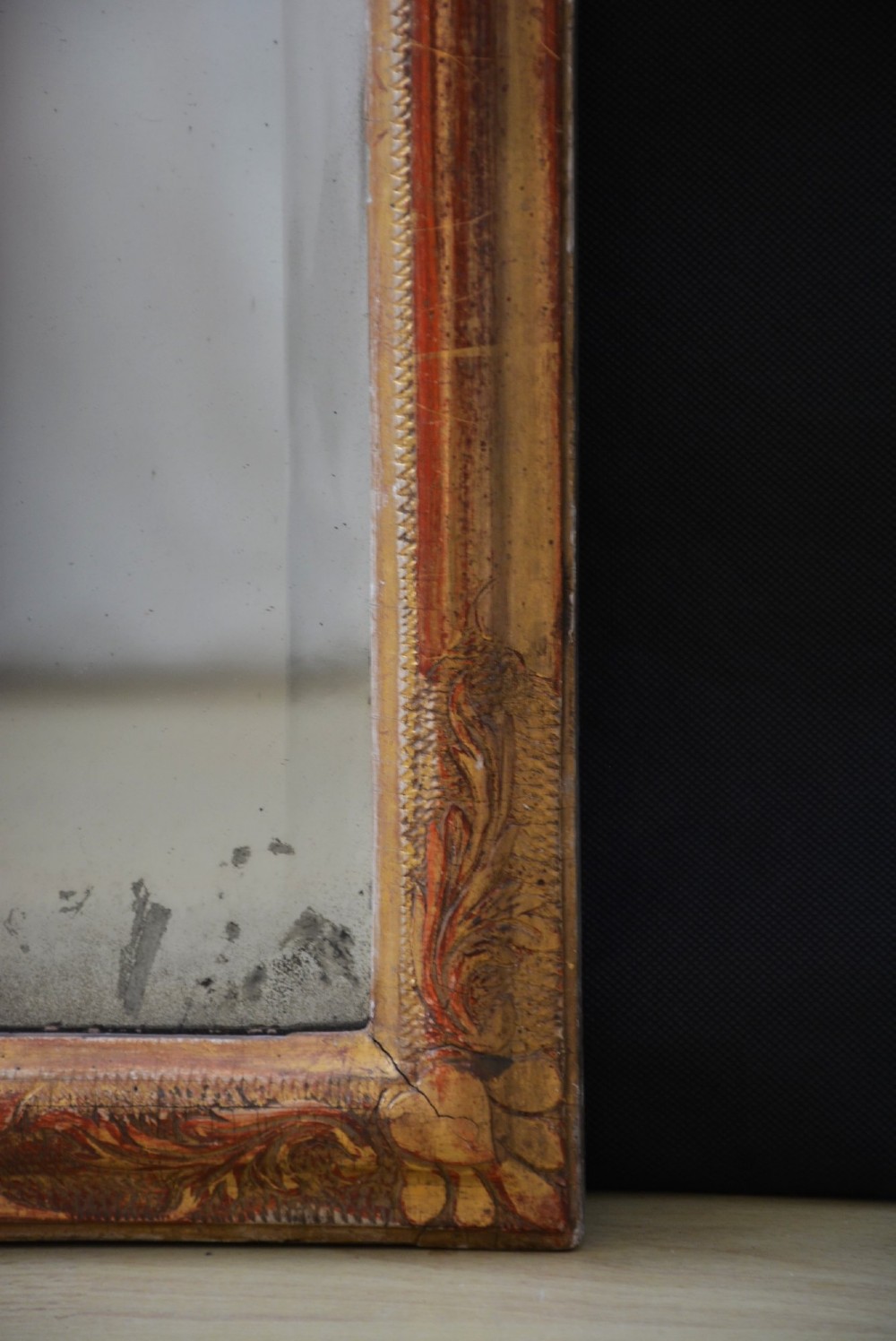 A tall, narrow Georgian giltwood pier mirror featuring a carved shell crest, scrollwork frame, and a split glass mirror plate. View IV