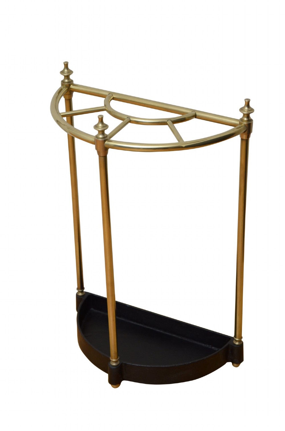 A semi-circular brass umbrella stand featuring vertical tubular supports, decorative finials, top divisions, and a black cast-iron drip tray base. View III