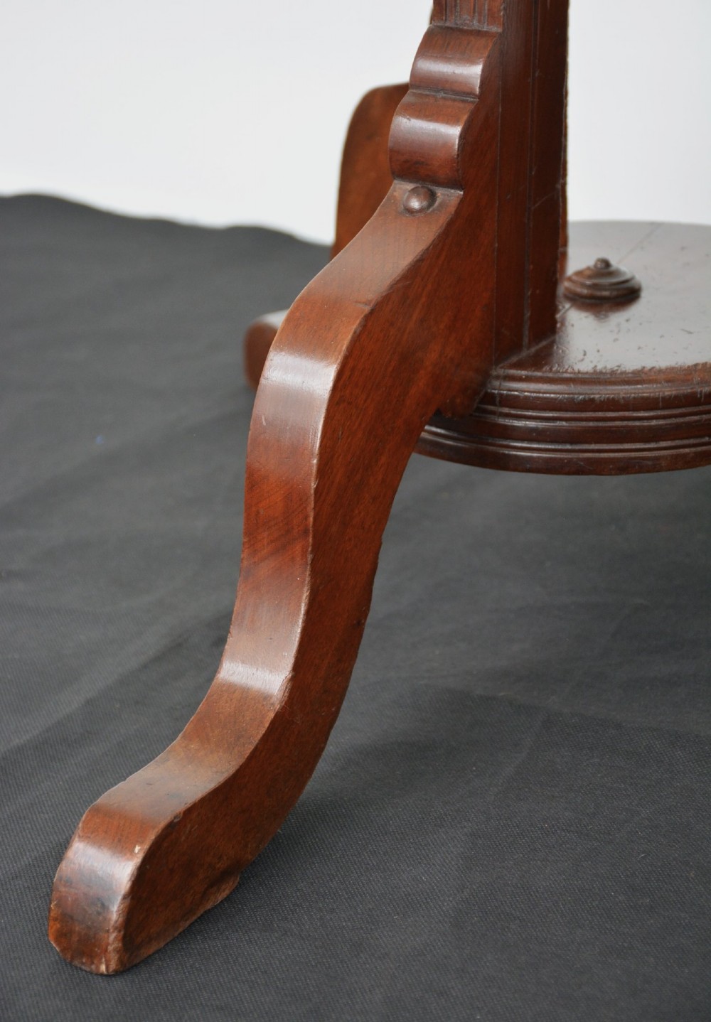 A tall freestanding dark walnut coat stand featuring a slatted central column, brass hooks, a turned finial, and four splayed feet. View IV