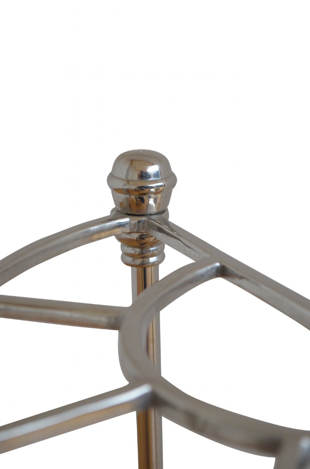 An Art Deco semi-circular nickel-plated umbrella stand featuring a fan-divided top section, three vertical support rods, and a black cast iron drip tray base. View V