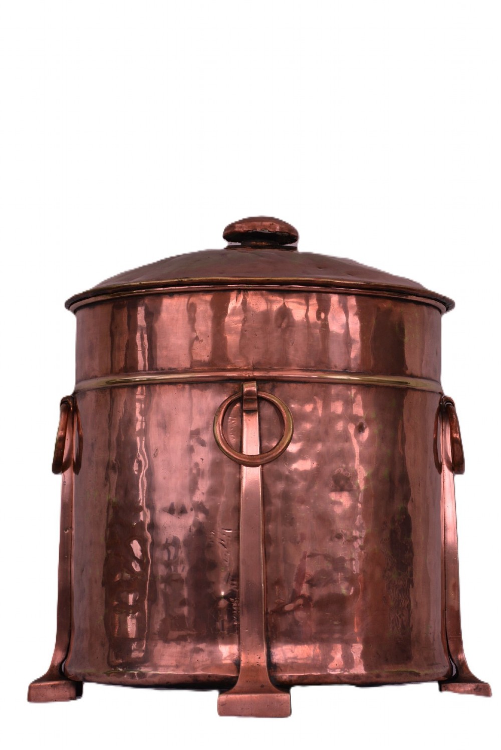 An Arts and Crafts hammered copper cylindrical coal bin featuring a fitted lid, drop side ring handles, structural legs, and a removable metal liner. View II