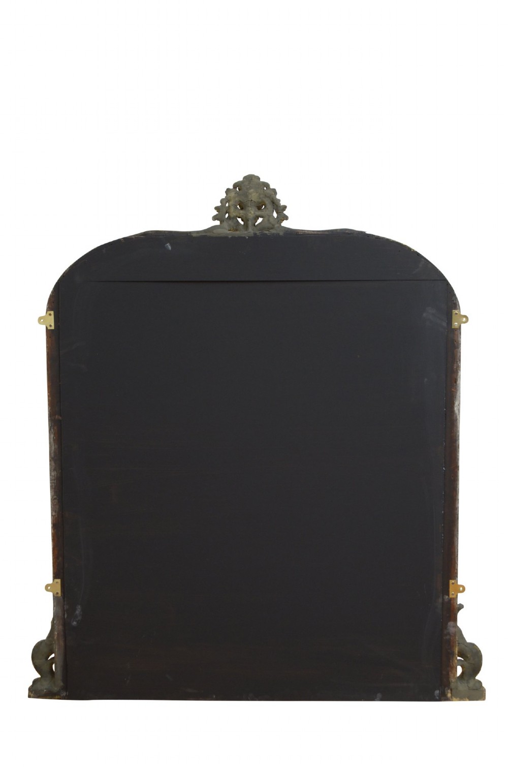 A tall arched overmantel mirror featuring a gold gilded frame decorated with an intricate carved top cresting and scroll base feet. View X