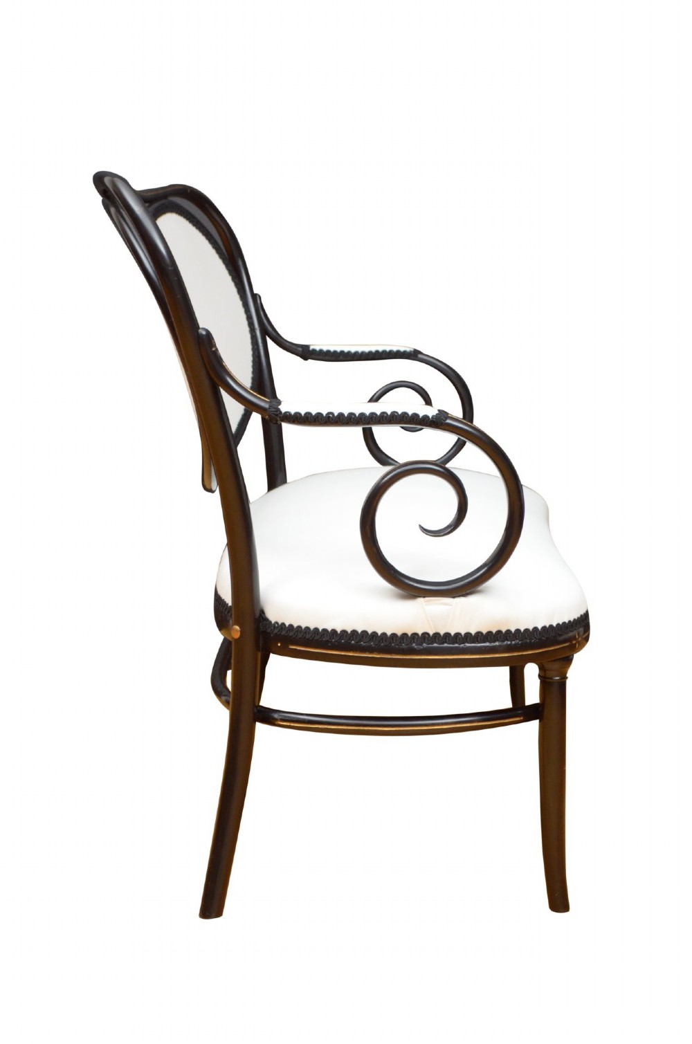 An ebonised bentwood armchair featuring white upholstered seat and back panels, scrolled armrests, and gold linear detailing on a black wooden frame. View XI